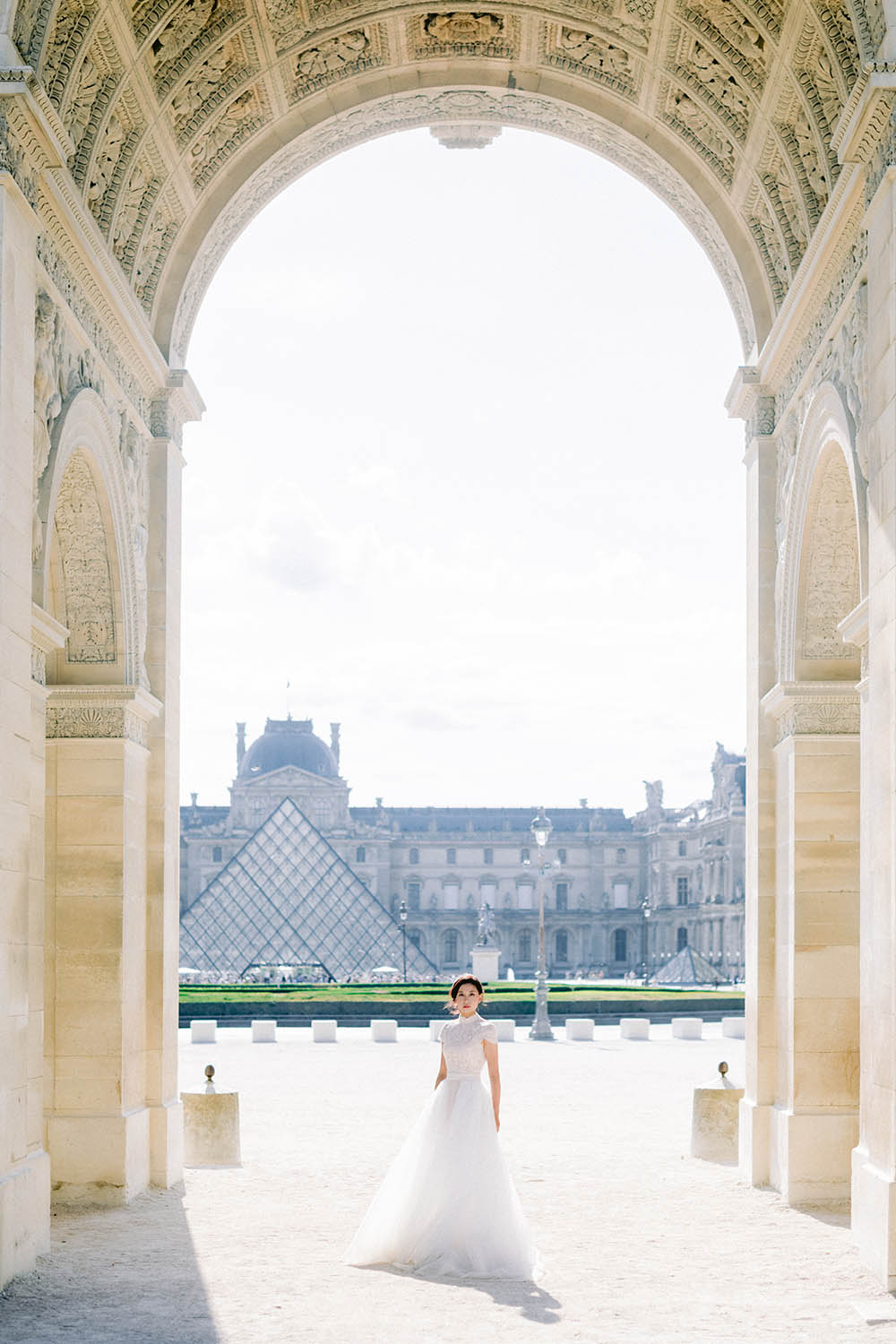 a bride under arch louvre